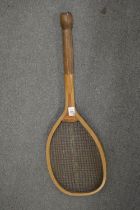 An early tennis racket.