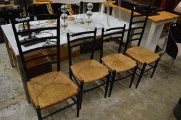 Otto Gerdau for Rooksmoor Mills, a pair of ebonised and rush seated tall ladderback dining chairs