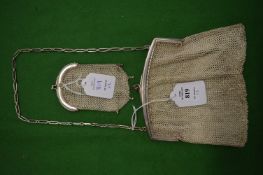 A silver chain mail evening bag and similar purse.