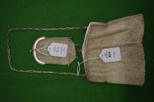 A silver chain mail evening bag and similar purse.