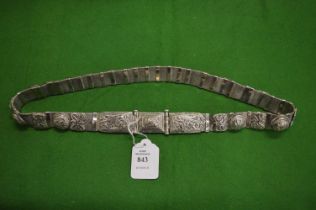 An Eastern white metal belt.