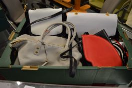 A collection of Lulu Guinness handbags.