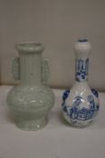 A small Chinese celadon glazed bottle vase and a small blue and white bottle vase.