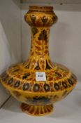 An Islamic Moorish slip glazed pottery pedestal vase.