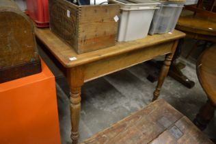 A pine kitchen table.