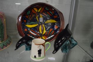A 1960-70's Poole pottery dish together with two Poole dolphins and a Carlton ware tankard.