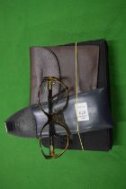 A leather case, cased glasses etc.