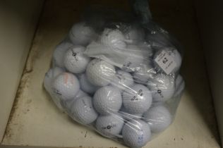 A bag of fifty Top Flite golf balls.