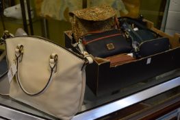 A collection of Radley and other handbags.