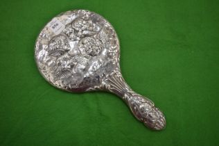 A silver backed dressing table mirror.