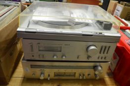 An Akai turntable, stereo tuner and a JVC amplifier.