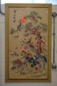 A good large Chinese embroidered picture depicting exotic birds by a tree.