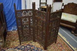 An Indian carved wood small folding screen.