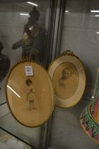 Two late 19th century ormolu oval photograph frames.