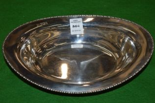 A silver oval dish.