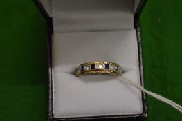 A 9ct white and yellow gold white sapphire and sapphire eternity ring.