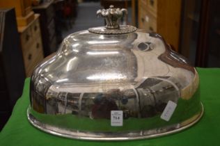 A large plated meat dome with engraved armorial.
