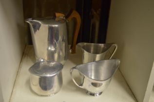 A Piquot Ware coffee pot and three similar items.