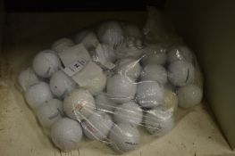 A bag of fifty Titleist golf balls.