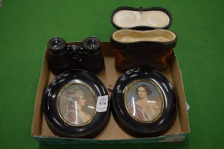 A pair of framed silhouettes and pair of opera glasses with case.