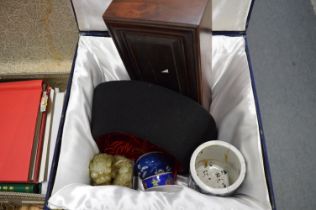 A boxed Chinese hat and other items.