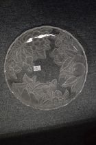 A large molded glass circular plate.