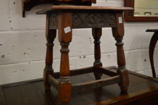 A carved oak joint stool.