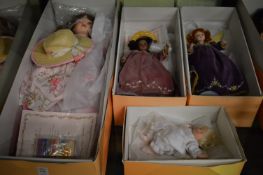 Four boxed collectors dolls.