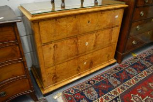 A 19th century Biedermeier satinwood three drawer commode.