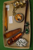 Cigarette holders, pendant ball watches and other items.