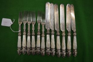 A set of six mother of pearl handled plated dessert knives and forks.