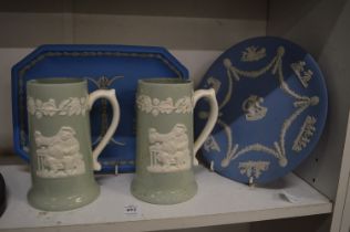 A Wedgwood blue jasperware circular plate together with three similar items.