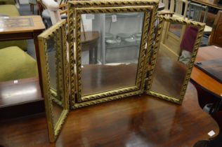 A gilt framed dressing table mirror.