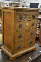 A small oak chest of drawers.