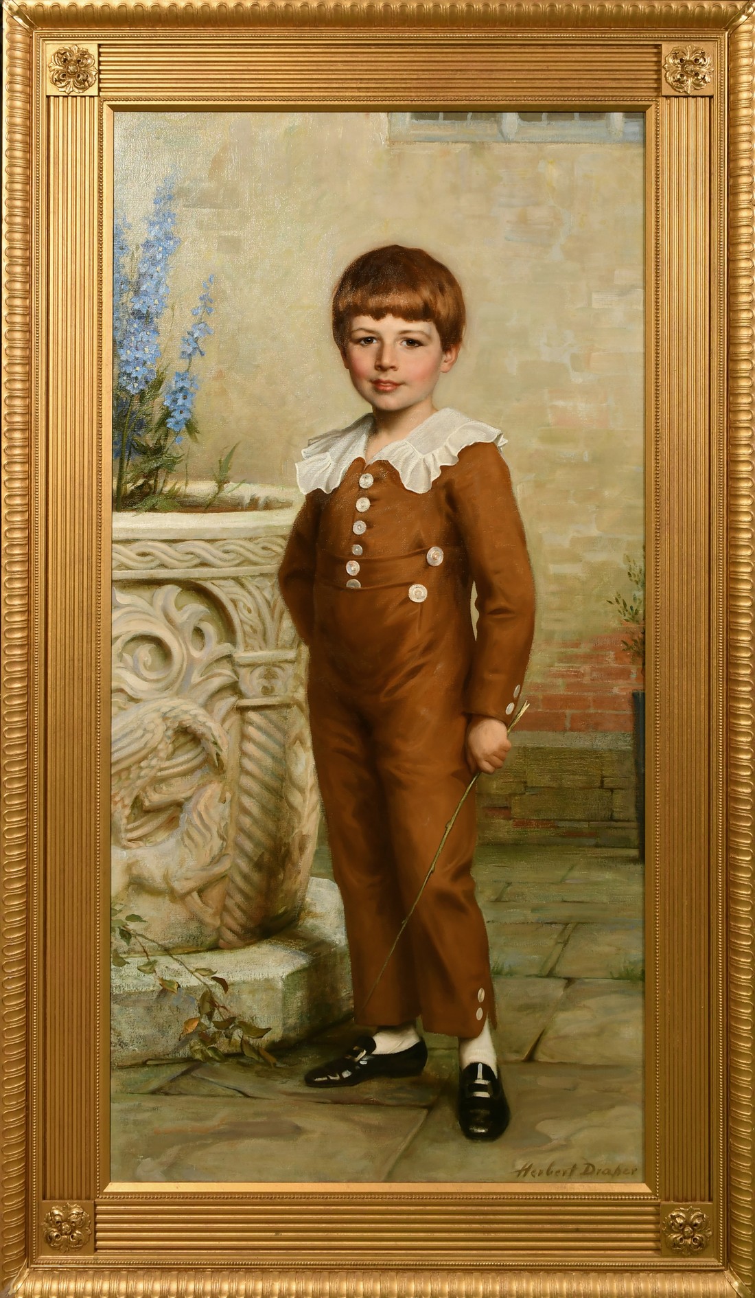 Herbert Draper, Circa 1900, a portrait of a young boy standing beside a carved urn, oil on canvas,