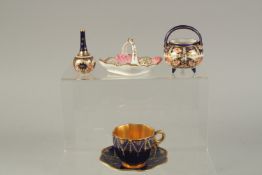 A COALPORT DEMI-TASSE COFFEE CUP AND SAUCER, with gilded festoons, two Royal Crown Derby miniatures,
