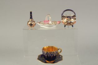 A COALPORT DEMI-TASSE COFFEE CUP AND SAUCER, with gilded festoons, two Royal Crown Derby miniatures,