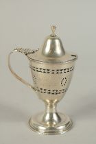 A GEORGE III SILVER MUSTARD POT with sapphire blue liner. Marks rubbed.