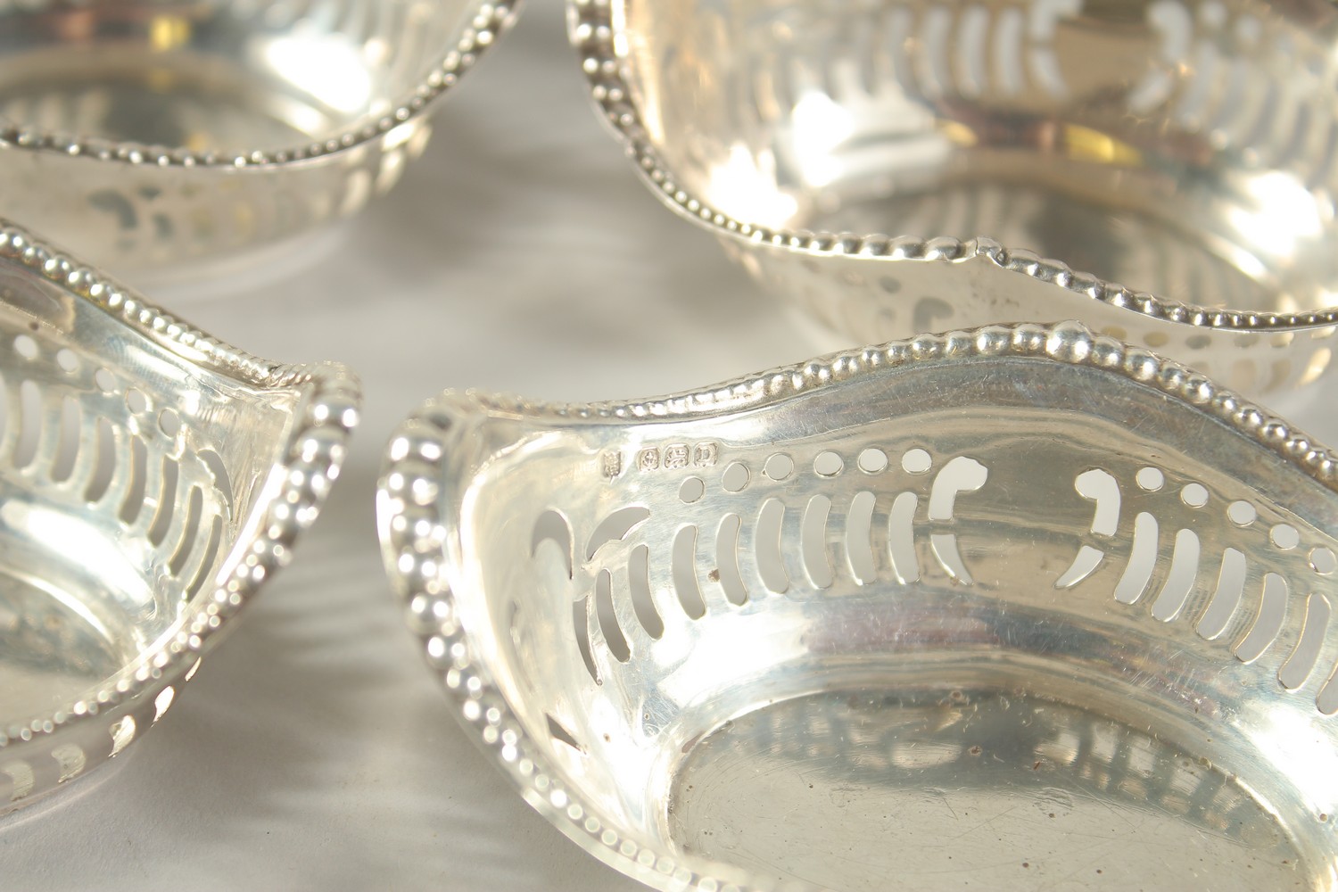 A SET OF FOUR OVAL PIERCED SILVER BON BON DISHES. 3.25ins long. Birmingham 1928. - Image 5 of 6