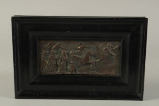 A FRAMED BRONZE PLAQUE. 3 x 6.5ins.