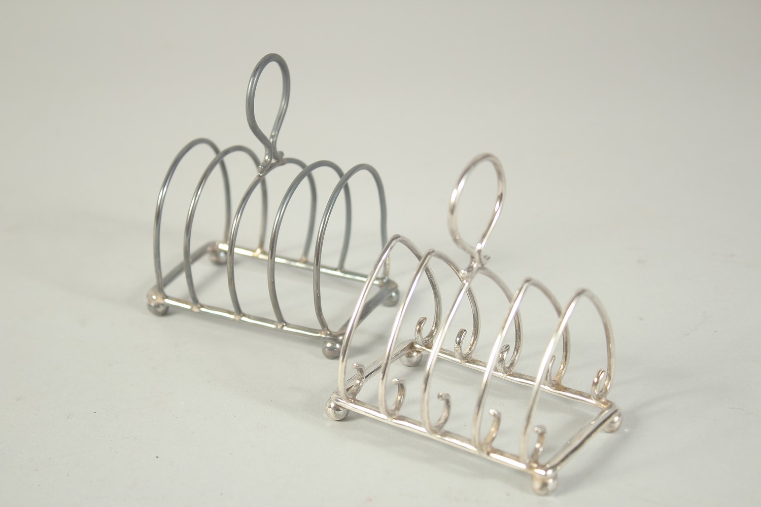 TWO SMALL SILVER TOAST RACKS. London 1903 and Sheffield 1902.