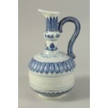 A CHINESE BLUE AND WHITE PORCELAIN EWER, with a band of carved floral decoration. 29cms high.