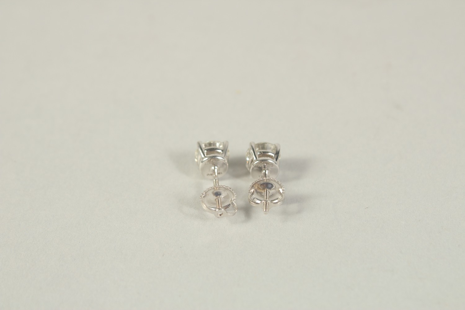 AN 18CT WHITE GOLD 1 CARAT EACH, DIAMOND STUD EARRINGS with screw fittings - Image 2 of 2