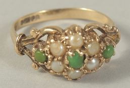 A 9CT GOLD CLUSTER TURQOUISE AND PEARL RING.
