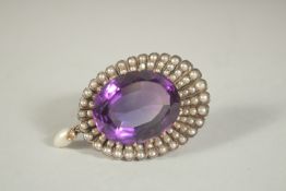A LARGE AMETHYST AND SEED PEARL BROOCH.