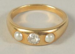 AN 18CT GOLD PEARL AND DIAMOND RING.