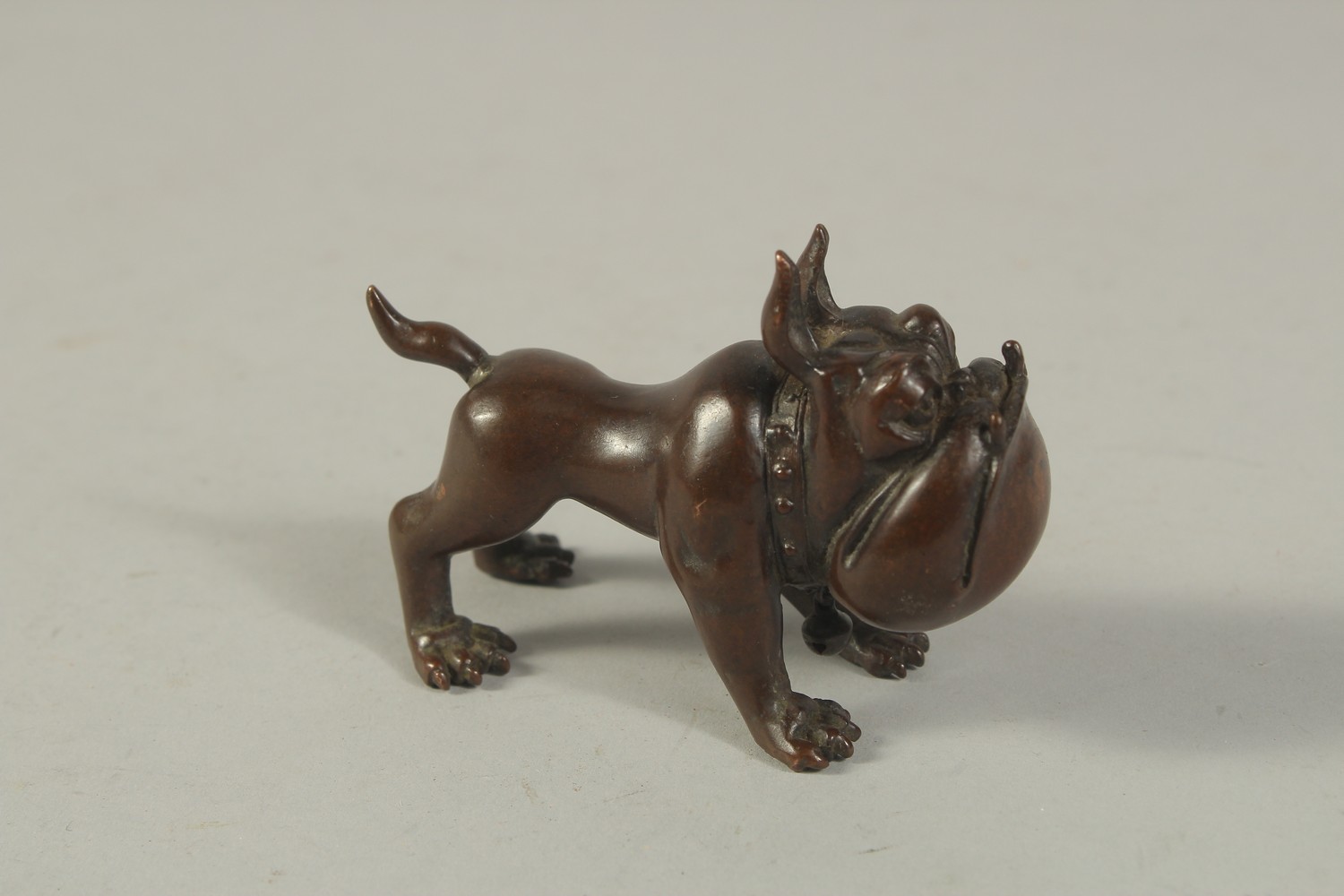 A BRONZE OKIMONO of a Dog. 8cms long. - Image 2 of 3