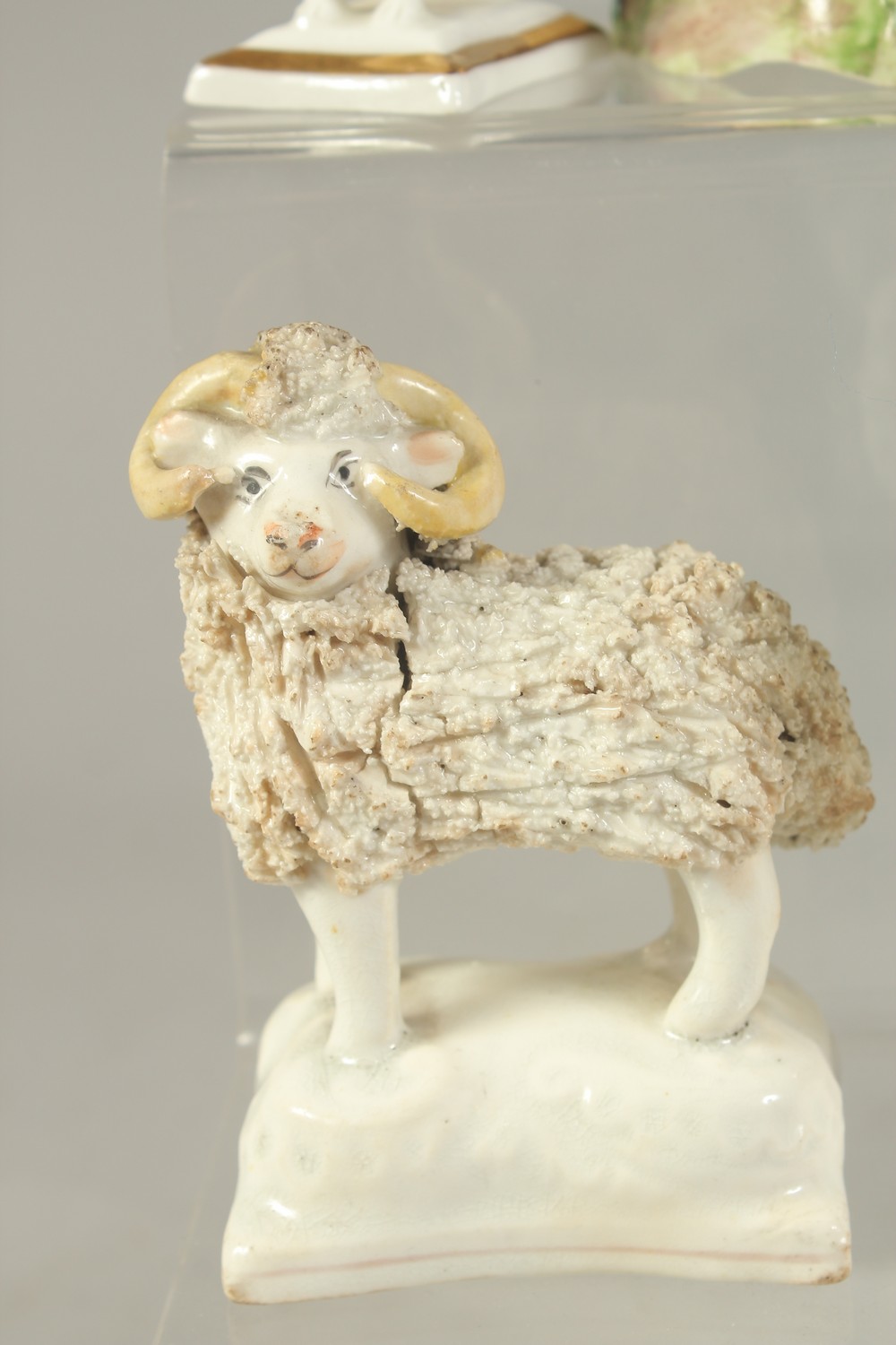 FOUR STAFFORDSHIRE TYPE POODLES, a similar ram and a ceramic cottage with wooden roof. - Image 5 of 7