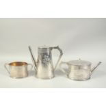 A GOOD ELKINGTON & CO. OVAL SILVER TEA POT , HOT WATER JUG AND SUGAR BASIN with a Chinese design and