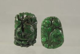 TWO CHINESE CARVED JADE PENDANTS.